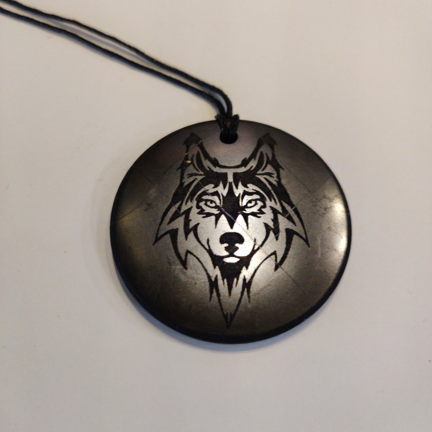 Shungite - pendant circle 30 mm "Wolf"