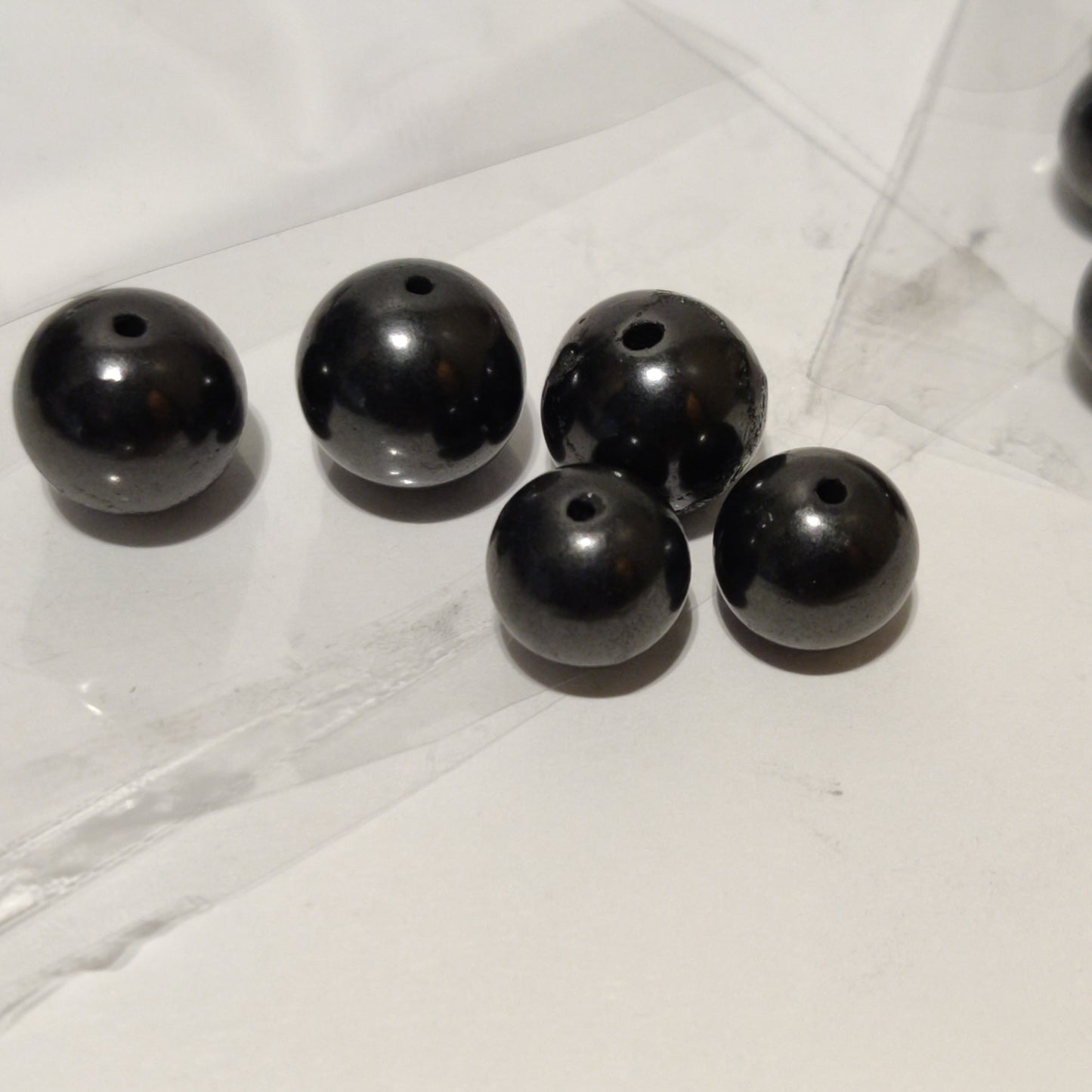 Shungite polished beads & bracelets
