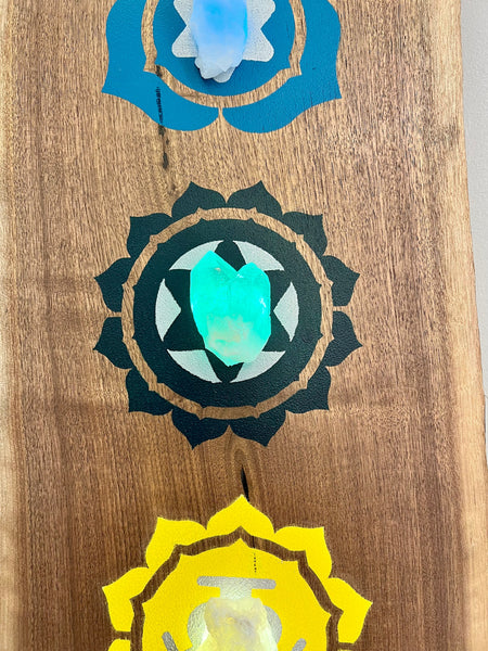 Walnut slab 6 ft with painted chakra symbols and natural crystals